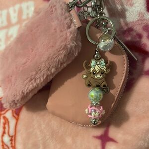 Cute cow keychain with a teal bow